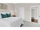 Light filled bedroom featuring a lamp-lit nightstand and white walls at 12424 Bradford Park Dr, Davidson, NC 28036