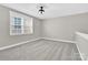Well-lit bonus room with neutral paint, plush carpet, and a large window offering ample natural light at 12424 Bradford Park Dr, Davidson, NC 28036