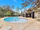 A spacious community pool with comfortable seating, a covered pavilion and a nearby playground at 12424 Bradford Park Dr, Davidson, NC 28036