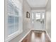Bright foyer featuring hardwood floors, neutral walls, and a window allowing natural light at 12424 Bradford Park Dr, Davidson, NC 28036
