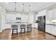 Bright kitchen featuring a large island, pendant lighting, and modern appliances at 12424 Bradford Park Dr, Davidson, NC 28036