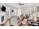 Inviting living room with a fireplace, hardwood floors, and comfortable seating arrangement at 12424 Bradford Park Dr, Davidson, NC 28036