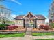 Stairway and entrance to a well-maintained community pool with lush landscaping and elegant clubhouse at 12424 Bradford Park Dr, Davidson, NC 28036