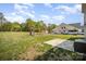 Spacious backyard featuring a playset, patio, and ample room for outdoor activities, with a parked RV in the background at 1436 Yellowstone Ct, Gastonia, NC 28054