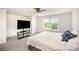 Large bedroom with ceiling fan, large windows, and television on stand at 1436 Yellowstone Ct, Gastonia, NC 28054