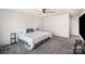 Spacious carpeted bedroom with ceiling fan and natural light at 1436 Yellowstone Ct, Gastonia, NC 28054