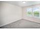 Neutral bedroom with gray carpet, two windows bringing in natural light at 1436 Yellowstone Ct, Gastonia, NC 28054