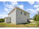 Rear exterior of a home featuring gray siding, a patio, and a grassy backyard at 1436 Yellowstone Ct, Gastonia, NC 28054