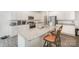 Well-appointed kitchen with stainless appliances, granite countertops, seating at the island, and light grey floors at 1436 Yellowstone Ct, Gastonia, NC 28054