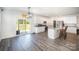 Bright eat-in kitchen features white cabinets, granite countertops, stainless appliances, and sliding glass door to backyard at 1436 Yellowstone Ct, Gastonia, NC 28054