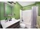 Bright bathroom with a shower-tub combo and vanity with dark wood accents at 147 Gabriel Dr, Mooresville, NC 28115
