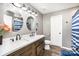 Bathroom with a double sink vanity, wood cabinets, and modern fixtures in a stylish design at 147 Gabriel Dr, Mooresville, NC 28115