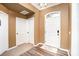 Inviting foyer with hardwood floors, a white front door, and neutral wall colors at 147 Gabriel Dr, Mooresville, NC 28115