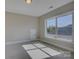 Bedroom featuring carpet floors and a window that provides natural lighting at 14916 Creeks Edge Dr, Charlotte, NC 28278
