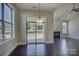 Bright dining area with large windows overlooking backyard and access to living room at 14916 Creeks Edge Dr, Charlotte, NC 28278