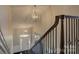 Spacious foyer features wrought iron staircase, grand lighting and a welcoming entry at 14916 Creeks Edge Dr, Charlotte, NC 28278