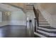Spacious foyer with dark hardwood flooring, staircase, and chandelier at 14916 Creeks Edge Dr, Charlotte, NC 28278