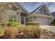 Lovely home with brick and stone features, a two-car garage, and well-maintained landscaping at 14916 Creeks Edge Dr, Charlotte, NC 28278