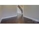 Room with dark hardwood floors and white trim at 14916 Creeks Edge Dr, Charlotte, NC 28278