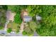 Aerial view of the house and surrounding landscaping, situated on a tree lined street at 1519 Briarfield Dr, Charlotte, NC 28205