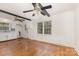 Open layout featuring hardwood floors, beamed ceilings, modern appliances, and ample kitchen storage space at 1519 Briarfield Dr, Charlotte, NC 28205