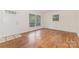 Bright and inviting living room with hardwood floors, complemented by natural light streaming through the windows at 1519 Briarfield Dr, Charlotte, NC 28205
