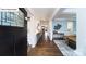 Elegant foyer featuring hardwood floors, wainscoting, decorative lighting, and an open view of the dining area at 152 Ventor Way, Mooresville, NC 28115