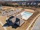 Aerial view showcases community clubhouse, pool, ample parking, and a nearby playground at 15212 Keyes Meadow Way, Huntersville, NC 28078