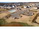Aerial view featuring neighborhood amenities including a sparkling community pool, playground, and parking at 15212 Keyes Meadow Way, Huntersville, NC 28078