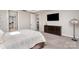 Spacious bedroom with plush carpeting, flat screen television, and a large wooden dresser at 15212 Keyes Meadow Way, Huntersville, NC 28078