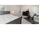 Inviting bedroom featuring a dark bed frame and an exercise bike for a personal fitness space at 15212 Keyes Meadow Way, Huntersville, NC 28078