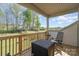 Cozy deck with comfortable seating and a view of the lush, fenced backyard, perfect for outdoor living at 15212 Keyes Meadow Way, Huntersville, NC 28078