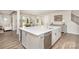 Modern kitchen with island and stainless steel appliances at 15212 Keyes Meadow Way, Huntersville, NC 28078