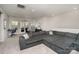 Spacious living room featuring a large gray sectional sofa and a bright, inviting atmosphere at 15212 Keyes Meadow Way, Huntersville, NC 28078
