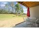 Covered patio area with outdoor seating, ideal for relaxing and enjoying the expansive fenced backyard at 15212 Keyes Meadow Way, Huntersville, NC 28078