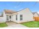 Backyard view featuring a patio, windows and white siding under a blue sky at 1671 Sandpiper Dr, Rock Hill, SC 29732