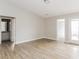 Open-concept living room featuring vinyl wood flooring and patio access at 1671 Sandpiper Dr, Rock Hill, SC 29732