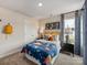 Bedroom with playful decor, featuring a window, closet, and carpeted floor, ideal for a space at 1730 Braemar Village Dr, Monroe, NC 28110