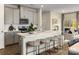 Modern kitchen with a large island, sleek countertops, and stainless steel appliances at 1730 Braemar Village Dr, Monroe, NC 28110