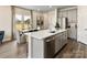 Modern kitchen with a large island, stainless steel appliances, and an inviting dining area at 1730 Braemar Village Dr, Monroe, NC 28110