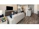 Open concept living space with hardwood floors flowing into the kitchen and dining area at 1730 Braemar Village Dr, Monroe, NC 28110
