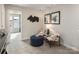 Cozy upstairs loft space with plush carpeting, a seating area, and decor at 1730 Braemar Village Dr, Monroe, NC 28110