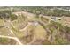 An aerial view of a house surrounded by green space and scattered trees at 1853 Beach Ln, Heath Springs, SC 29058