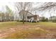 Expansive backyard showcasing lush greenery and a charming patio area, perfect for outdoor enjoyment at 1853 Beach Ln, Heath Springs, SC 29058