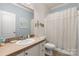 Cozy bathroom featuring a shower and tub combination with neutral tile and vanity at 1853 Beach Ln, Heath Springs, SC 29058