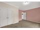 Bright and airy bedroom with neutral carpet and double-door closet, creating a relaxing retreat at 1853 Beach Ln, Heath Springs, SC 29058