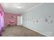 Bright bedroom featuring carpeted floors and delightful wall decor, creating a playful space at 1853 Beach Ln, Heath Springs, SC 29058