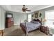 A main bedroom with high ceilings, a ceiling fan, a bed and a dresser at 1853 Beach Ln, Heath Springs, SC 29058