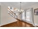 Foyer with hardwood floors, stairs, and a front door with sheer curtains at 1853 Beach Ln, Heath Springs, SC 29058