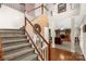 Elegant foyer with staircase and wood flooring, leading into the spacious living area at 1853 Beach Ln, Heath Springs, SC 29058